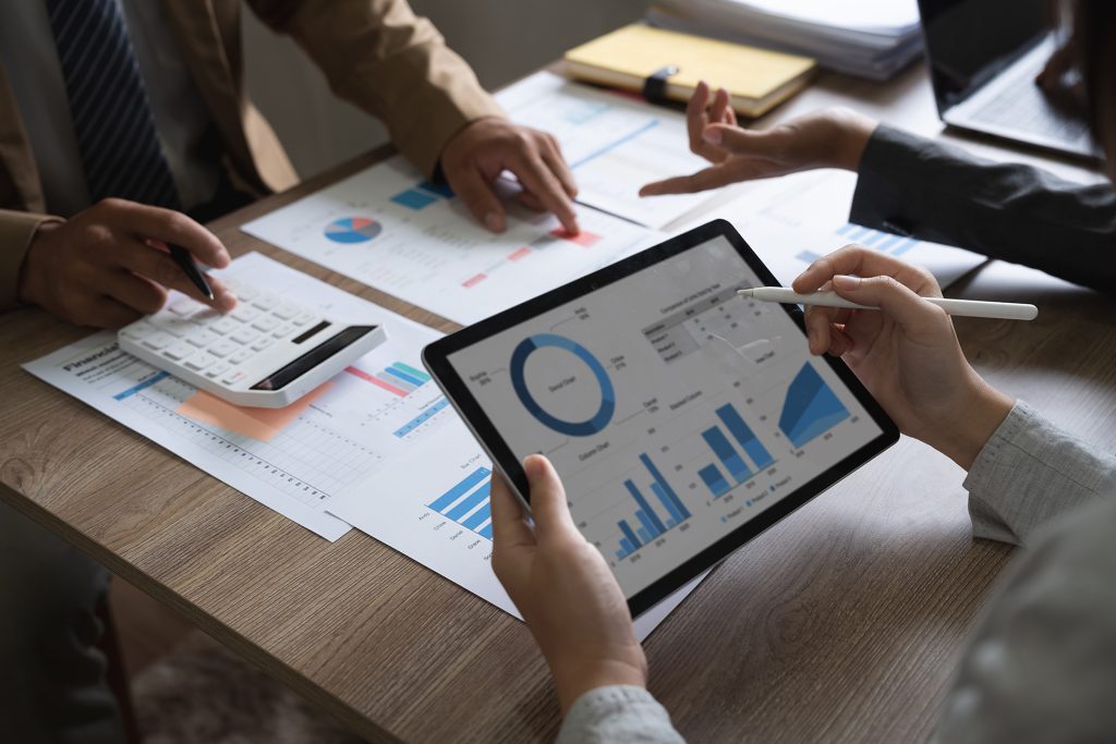 business adviser meeting to analyze and discuss the situation on the financial report in the meeting room.Investment Consultant, Financial advisor and accounting concept.